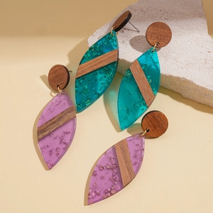 Bohemian leaf-shaped earrings made of dark wood and resin with gold foil details