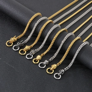 Detail of punk style titanium steel chains with lion, dragon and skull head clasps