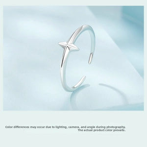 Detailed macro view of S925 sterling silver open ring with a 3D four-pointed star motif