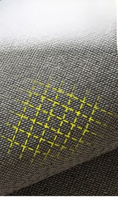 Detail of eco-friendly linen rug with yellow silicone non-slip backing for safety