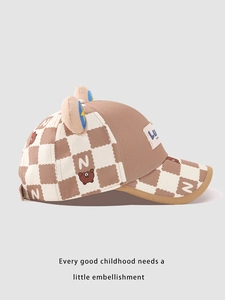 Detailed side view of kids baseball cap with cartoon bear ears and checkered brim pattern