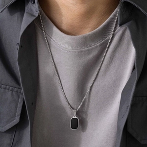 Men's minimalist stainless steel necklace featuring a black rectangular pendant on cuban chain