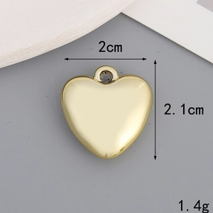 Polished gold heart charm pendant with bow detail showing dimensions of 2.1cm by 2.0cm