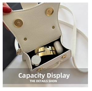 Mini white leather Kelly bag interior showing capacity for lipstick and earbuds