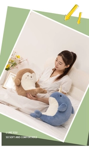 Soft plush shark and narwhal stuffed toys displayed in a cozy bedroom scene