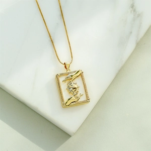 18K gold plated necklace with square shell pendant featuring sun and eye engravings