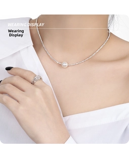 Elegant wearing display of 925 silver necklace with a round white pearl on a model