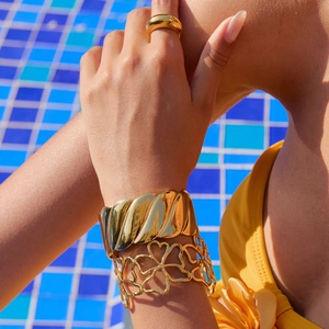 18K gold plated stainless steel bangles featuring heart cutout and swirl texture details