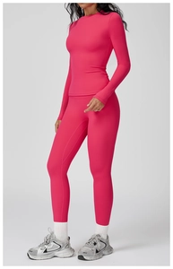 Detailed side view of pink long sleeve yoga top and high waist leggings fitness set