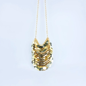 Detailed view of shimmering gold layered sequin design for a petite crossbody mobile bag