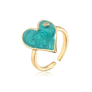 Detail of teal heart enamel with marble texture and cubic zirconia on golden open ring