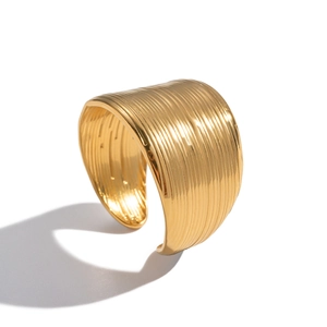 Minimalist wide gold open bangle with vertical stripe texture in stainless steel