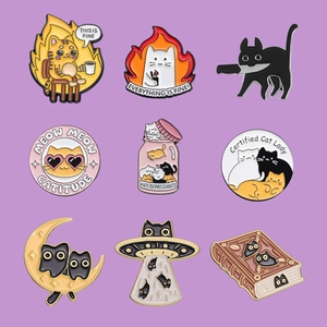 Set of 9 funny cat enamel pins and brooches in various quirky designs for clothes and bags
