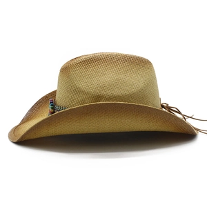 Close-up of a woven straw cowboy hat with colorful beaded band and leather tassel detail