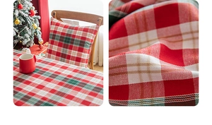 Close-up of festive red and green plaid tablecloth fabric with detailed woven texture