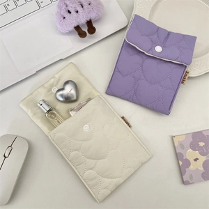 Quilted heart pouch in purple and beige with button closure for daily organization