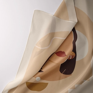 Close-up of minimalist abstract female face art on soft bohemian fabric tapestry