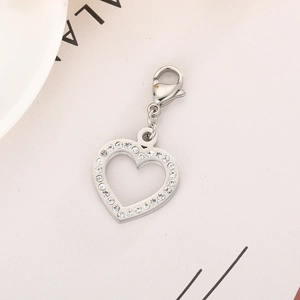 Macro shot of silver heart pendant with sparkling crystals and lobster clasp closure