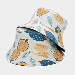 Reversible bucket hat with creative tropical durian fruit print in cream and black color