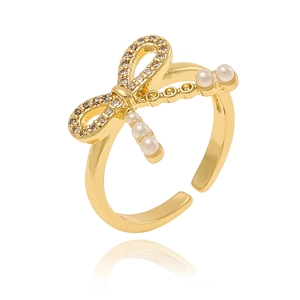 Detailed view of adjustable bow ring with sparkling crystals and small white pearls