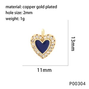 Macro detail of a 13mm heart pendant showing dimensions and gold plated copper texture