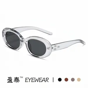 Retro oval cat eye sunglasses with translucent grey frames and dark UV protection lenses