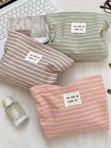 Striped cotton makeup bags in green, brown, and pink with a minimalist Japanese design