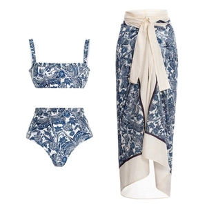 Three-piece bikini set with blue botanical dragonfly print and matching long wrap skirt