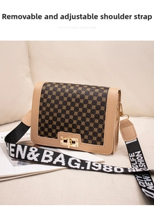 Close-up of vintage flap bag featuring jacquard patterned leather and gold twist lock