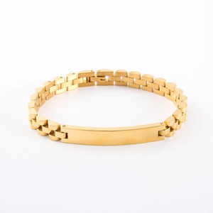Detail of golden stainless steel bracelet featuring a smooth rectangular engravable ID plate