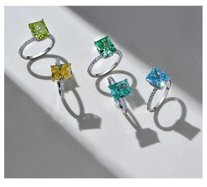 Macro shot of 925 silver rings with colorful square-cut gems and elegant shadows