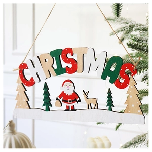 Detail of wooden Merry Christmas sign with Santa and reindeer on a tree branch