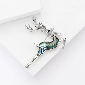 Elegant silver elk brooch with iridescent abalone shell inlay and a white pearl accent
