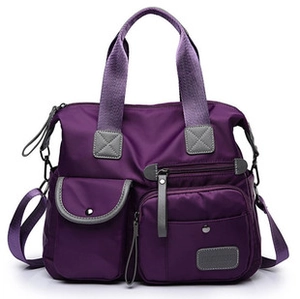 Detail of purple nylon multi-functional backpack with detachable straps and pockets