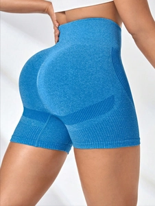 Macro detail of sky blue high waisted seamless yoga shorts with butt lifting scrunch design