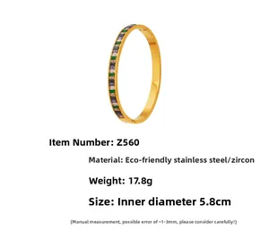 Detail of gold stainless steel bracelet with square colorful cubic zirconia inlay