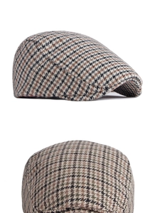 Détails de la texture du tissu en laine pied-de-poule des bérets de style anglais