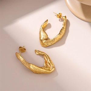 Chic 18K gold plated stainless steel irregular lava texture earrings on beige background