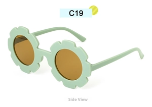 Side view of mint green sunflower sunglasses with brown round lenses for kids