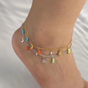 Double layer star and moon anklet with colorful beads and pearls on a model ankle