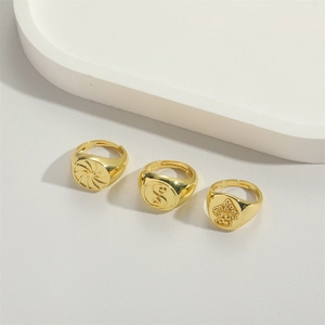 Adjustable gold flower signet rings with sun, snake and mushroom engravings