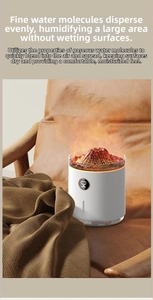 Mini volcano lava humidifier with digital display showing humidity on brown leather surface