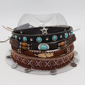 Detail of bohemian hat bands with turquoise, silver stars, and ethnic woven patterns