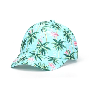 Detail of tropical baseball cap with pink flamingo and green palm tree patterns