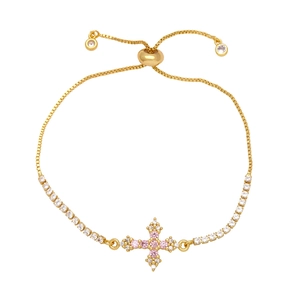 Cross pendant tennis bracelet with pink and white cubic zirconia in gold plating