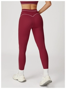 Rear view of wine red yoga leggings with white contrast stitching for fitness women