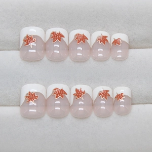 Short square press-on nails with cream French tips, red maple leaf and gold glitter edge