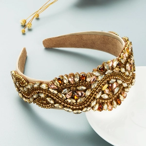 Macro detail of luxury baroque padded headband with sparkling amber rhinestones