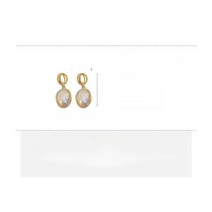 Detail view of oval pearl earrings with 5cm length dimensions and alloy material specs