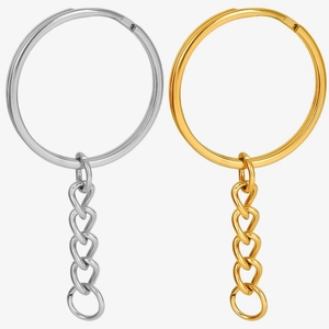 Detailed view of silver and 18K gold plated stainless steel keychains with chain links